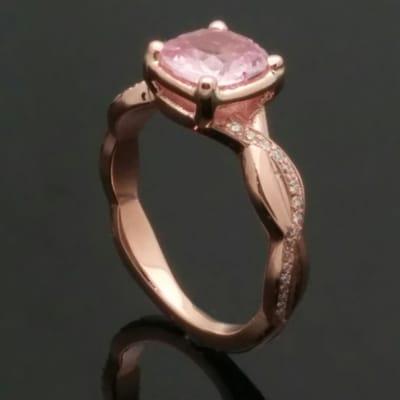 a peach sapphire in rose gold.