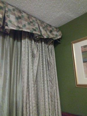 More filthy curtains hanging off