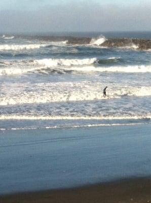 A surfer on Christmas Day. Best time to surf.