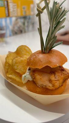 Paner salmon bites with a dill relish aïoli, glazed, pineapple and sesame kettle chips