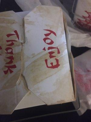 Cartons with sauce all over and broken container