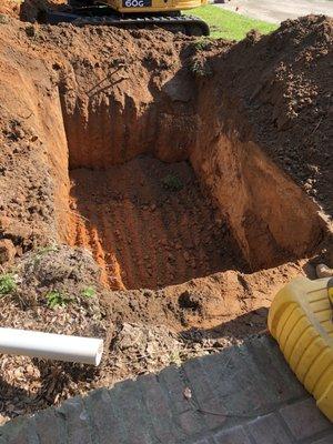 There's a hole...right next to the old septic tank which will get it's lid crushed.