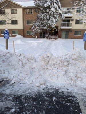 After they plowed and shoveled... How could someone handicap get over this?! Also half half assed sidewalk and stairs, front back and sides!