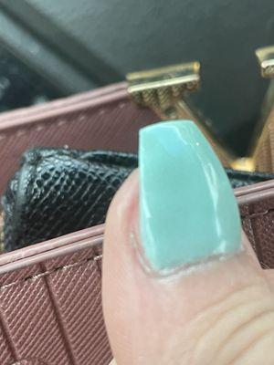 My real nail being exposed after I asked for them to shorten them.