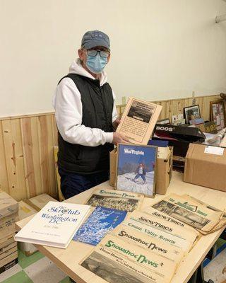 Anyd Snyder, SSMWV Board Member works on an exhibit for the Museum's opening day.