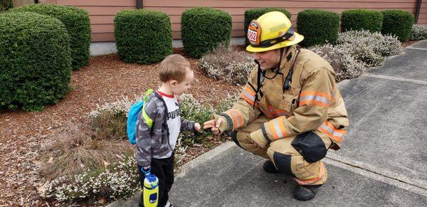 Our local firefighters borrowed the parking lot for training and our kiddos were so excited to talk to them!