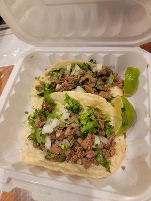 Asada tacos with cilantro and onion with handmade tortillas