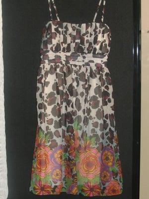 A beautiful multi-colored dress we have with full lining and a belt that ties in back