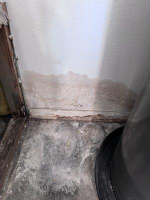 Mild and watermarks floor and wall in garage