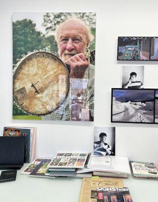 Inside of the shop- a collection of books printed in the shop, a plexiglass print, and other mounted prints