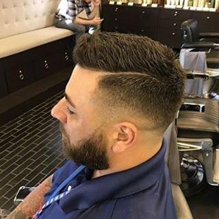 A sharp part and a perfect face by Jared at Aveda Men, a premier barbershop in downtown St. Petersburg, FL.