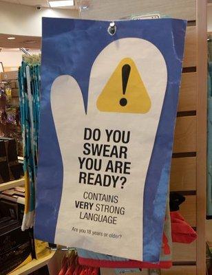 Paper sign covering items including profanity, immediately accessible to kids.