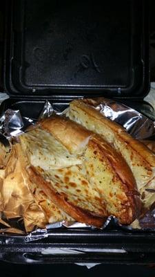 Rubbery garlic cheese bread that was smashed into a to go box. No dipping sauce offered either.