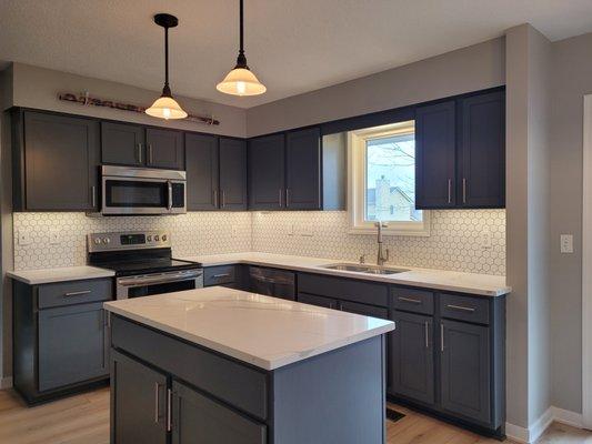 update cabinets w/ new doors, drawers soft close paint, backsplash n countertop