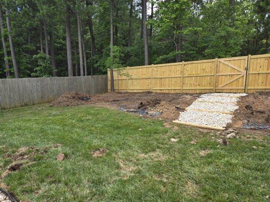 Landscape timbers used as stairs instead of railroad ties. River rock used instead of gravel.