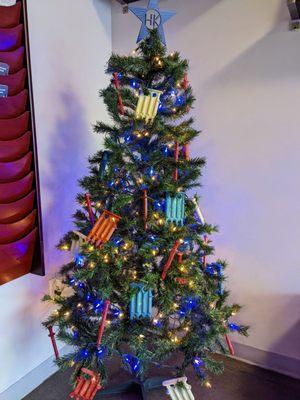 Christmas tree with composite action ties and standard ties hanging on it!