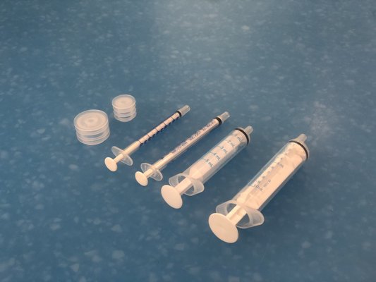 Syringes and bottle stoppers to make it easier to measure liquid medicine doses