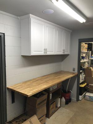 New cabinets and butcher block bar with floating brackets for break room.