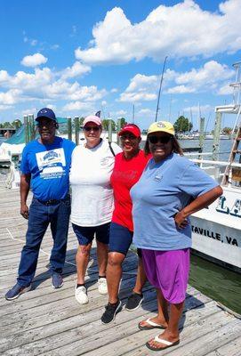 Happy people who went on a fishing trip.