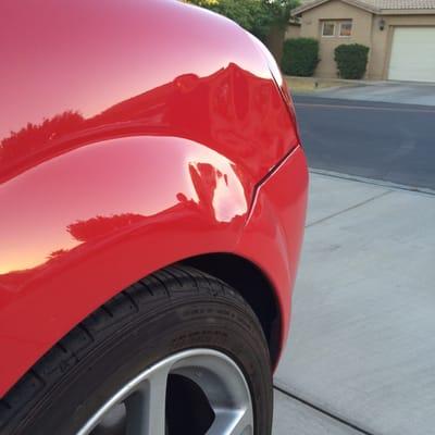 Large dent with paint chip, some asshole did a hit and run while it was parked.