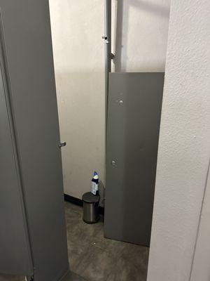 Broken door in woman's restroom stalls