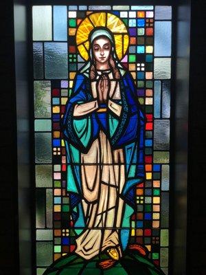 One of multiple stained glass windows of the Blessed Virgin Mary