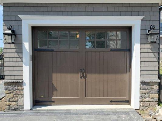 Custom-designed, custom-built CAMBEK carriage style wood garage door with decorative hardware