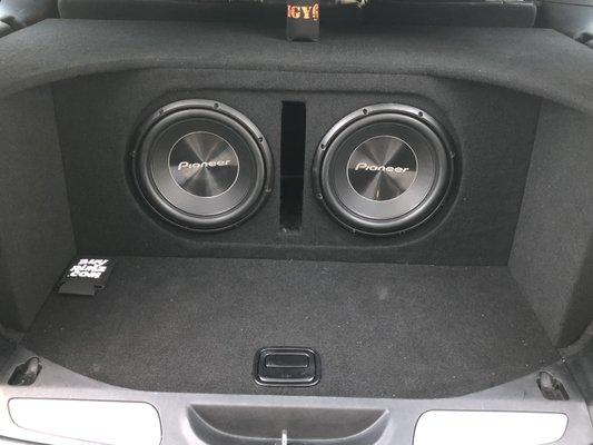 Custom subwoofer installation. 2 Pioneer subwoofers installed with custom trim panels in a Jeep Grand Cherokee