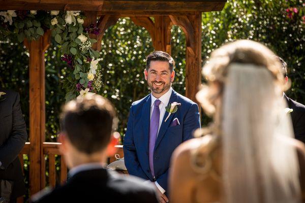 Groom watching his bride at Elliston Vineyards on 5-21-17.