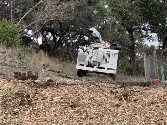 Remote control track chipper accesses work in difficult terrain.