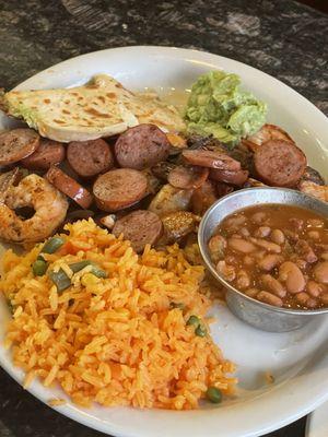 La Botana Beef, Chicken, Sausage, and Shrimp with Beans and Rice.