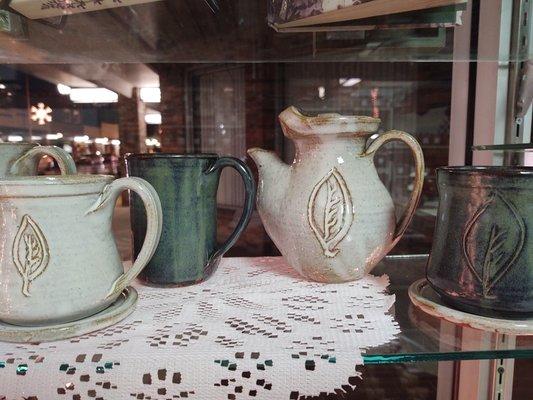 Tea pots and cups with our logo by Bolick Pottery and Traditions in Blowing Rock, NC