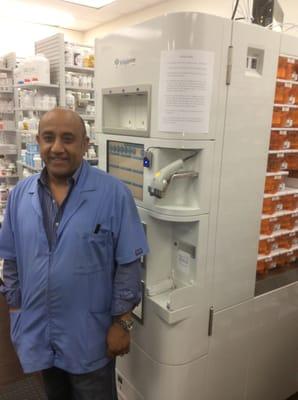 Raj, the pharmacy manager, next to Garfield's robot.  I love this place!