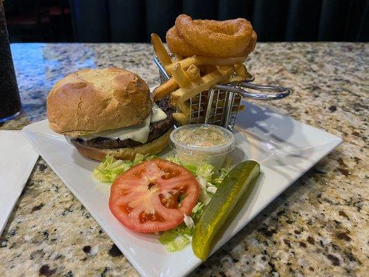 Cheeseburger with fries and onion rings.