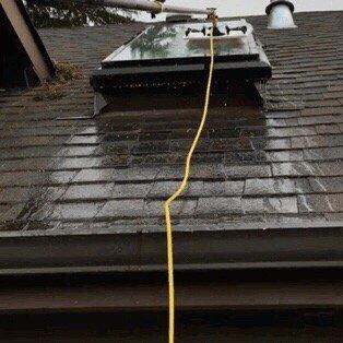 Water fed pole used to clean skylight, safe on the ground!