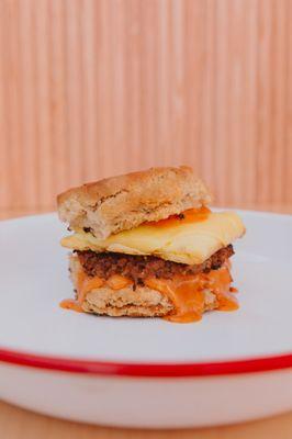 The Yes chef! A large herb biscuit with an impossible breakfast sausage patty, smoked gouda, just egg and chipotle mayo.