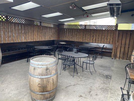 Outdoor covered smoking area with tv's