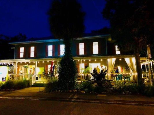 Front of building lit at night