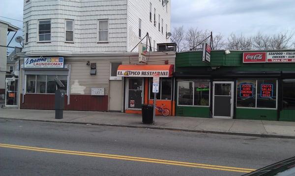 The storefront is under the orange awning. Parking is tough.