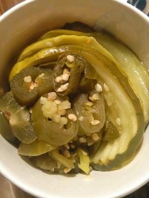 Side of pickles and jalapenos