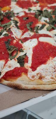 Closeup of the DELICIOUS Margherita Pizza.