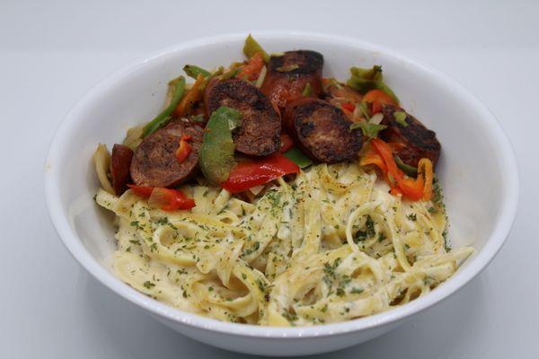 Sauteed mild sausage, onions, red and green bell peppers, cheese, fettucine in alfredo sauce and special seasonings.