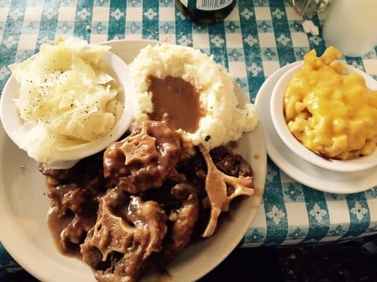 Oxtail Combo Plate w/ cabbage, mashed potatoes, and mac 'n cheese! Comes with 3 sides.