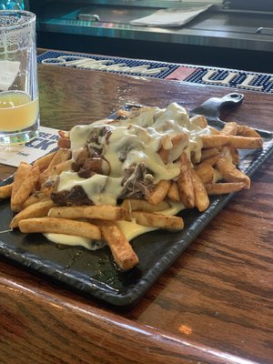 A boatload of cheesy, beefy delicious short rib fries