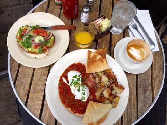 Yummy Tunisian eggs : poached eggs on spicy tomato sauce with home fries and pita bread + Avocado toast