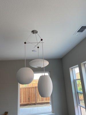 Ceiling light installation. Did an amazing job.  (DWR Nelson bubble)