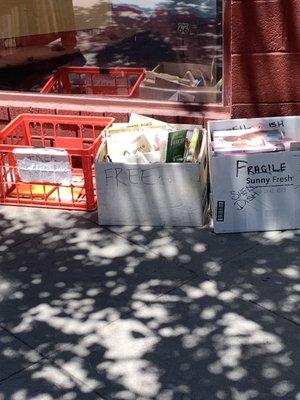 Free book bins in front of bookstore