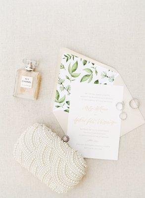 Gold foil invitation with calligraphy accents and watercolor envelope liner. Photo by Heather Roth Photography