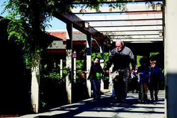 Kindergarteners return from an arts class.