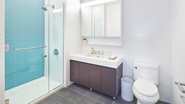 Large bathrooms with glass shower enclosure